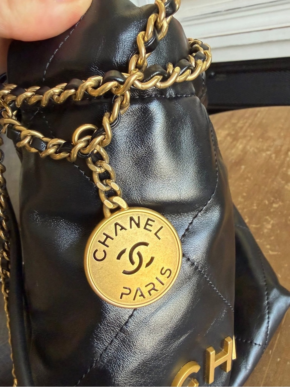 CHANEL Black Quilted Leather Mini Drawstring Bag with Gold Hardware - Picture 7 of 9